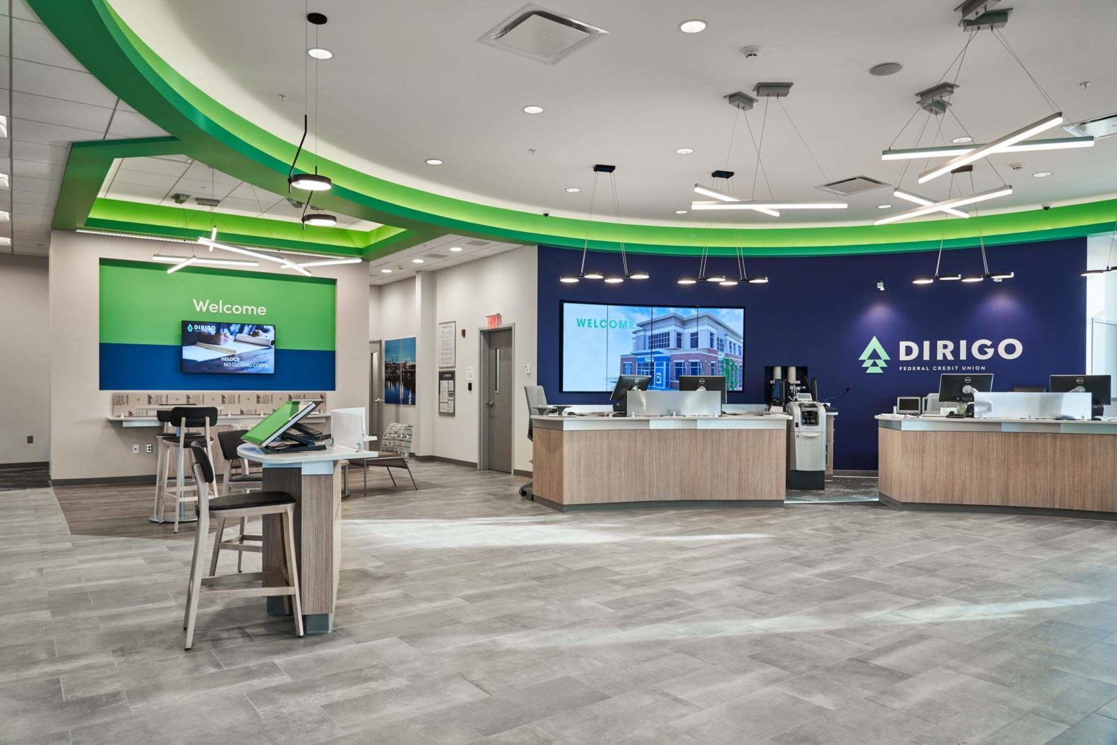 Dirigo federal credit union lobby area with tables and desks