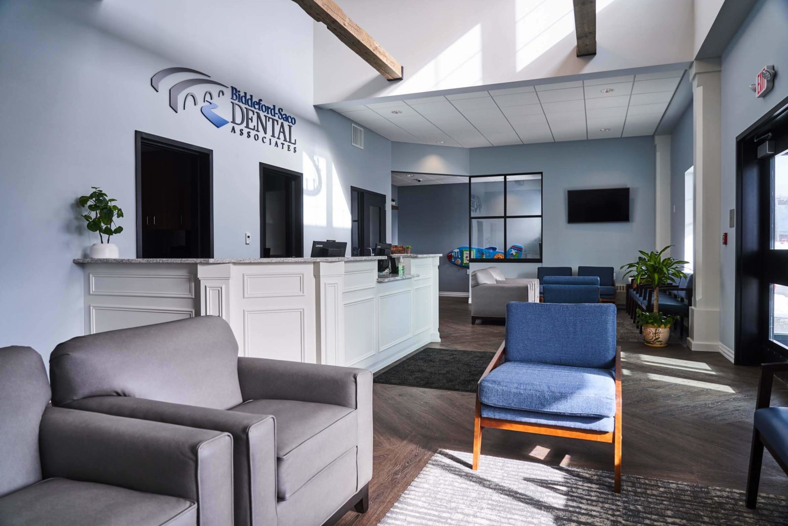 modern reception area with seating inside dental office