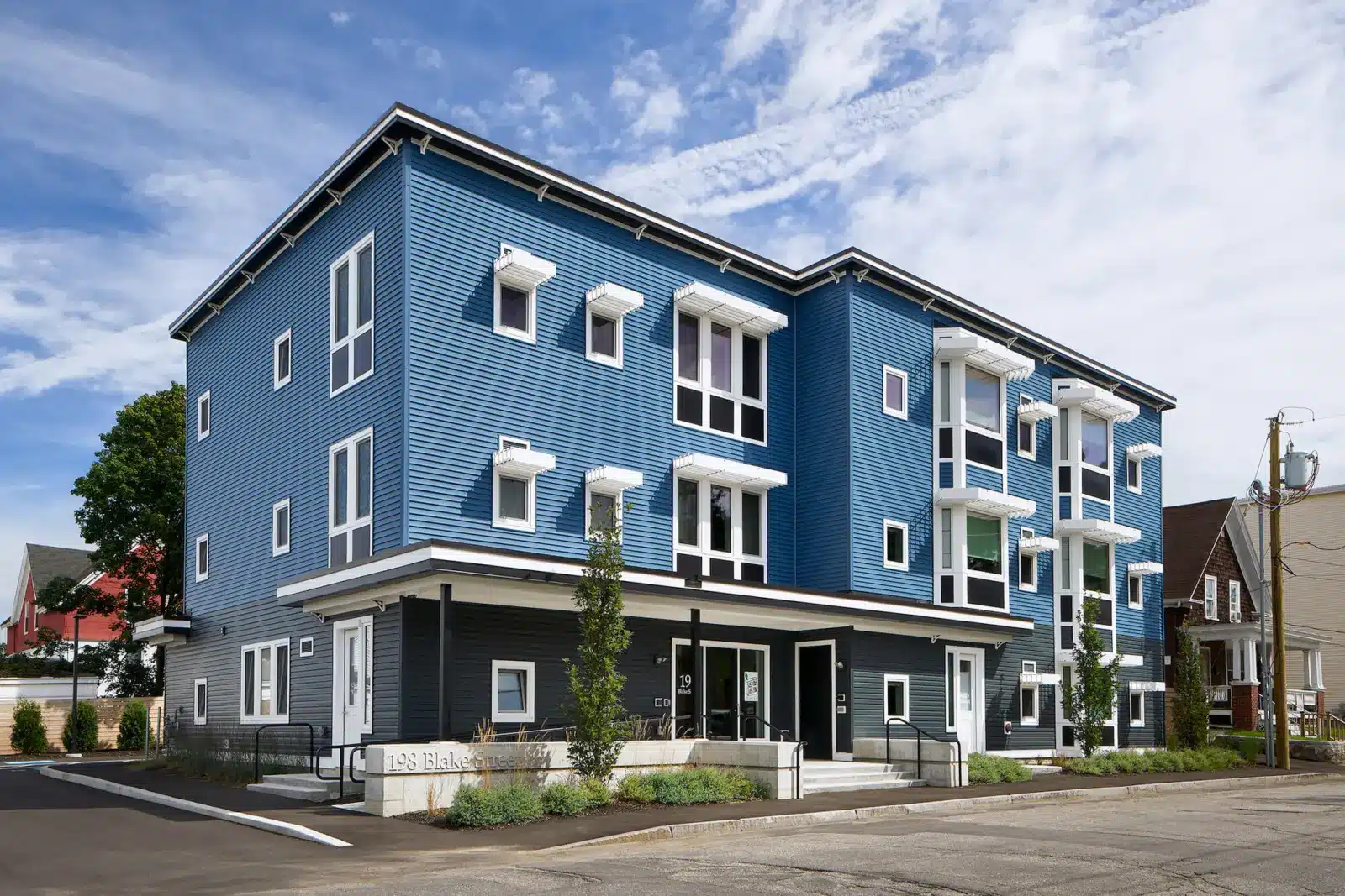 Exterior view of a blue building on Blake + Walnut Street
